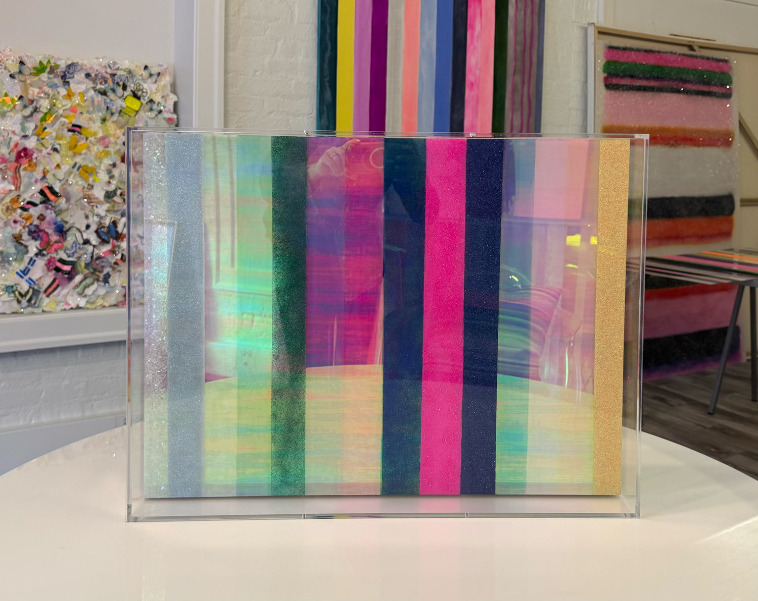 Striped Artwork with Color and glitter framed in lucite